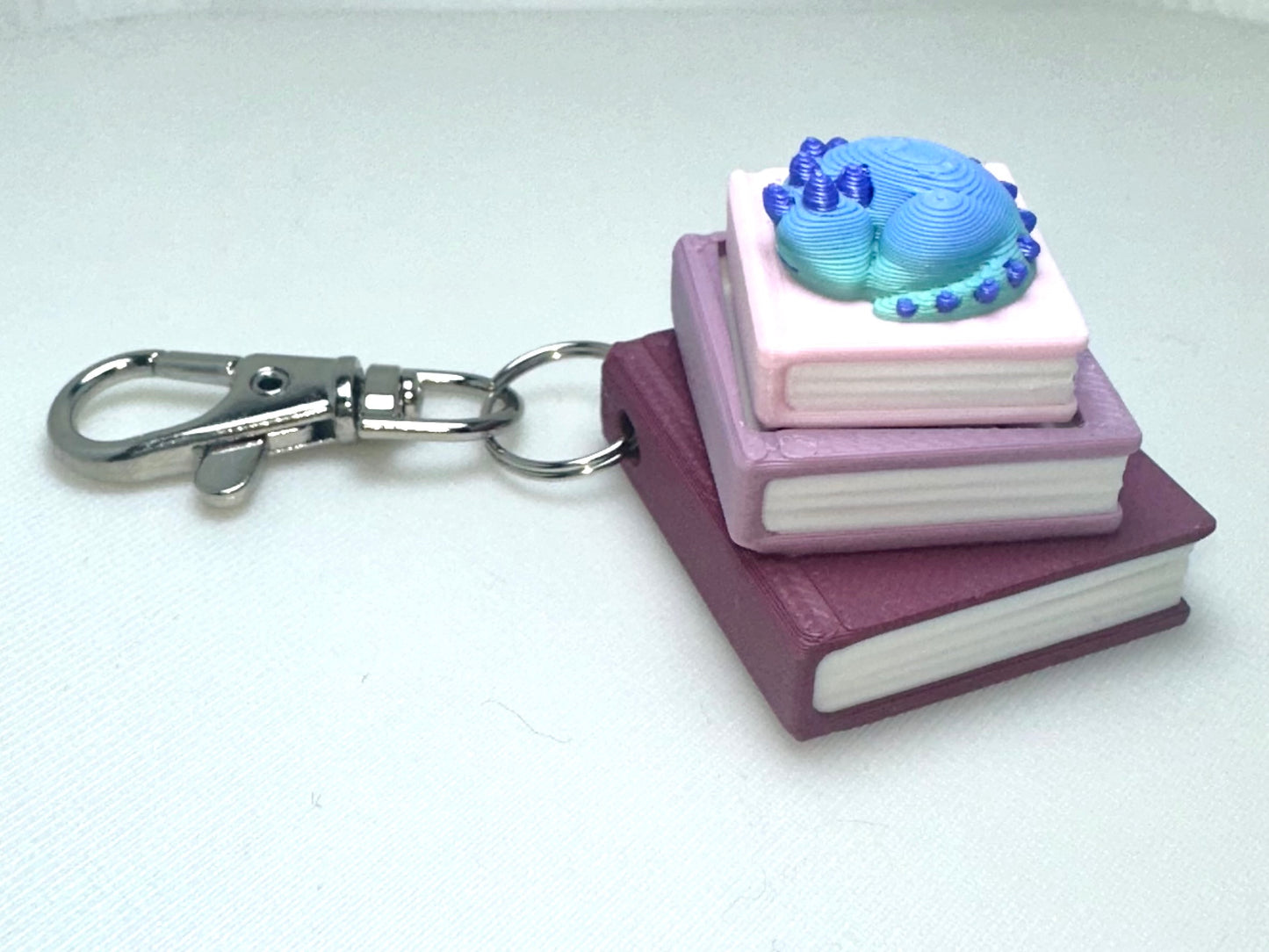 Book Stack with Dragon Fidget Clicker Keychain - CLICKY