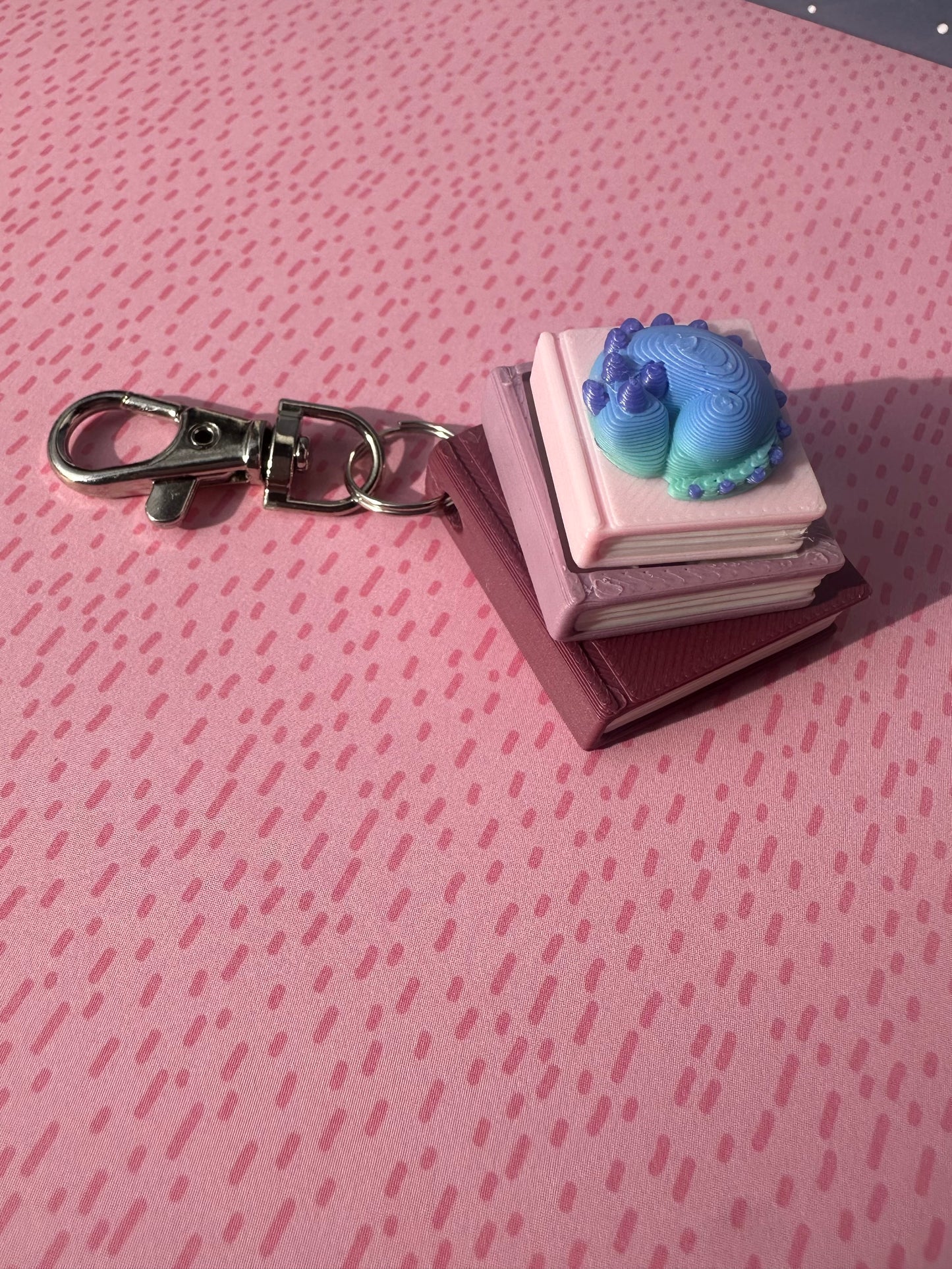 Book Stack with Dragon Fidget Clicker Keychain - CLICKY